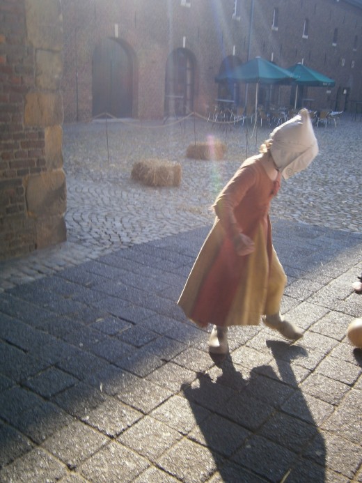 Children at play, gatehouse between fore-courtyard and main courtyard.
