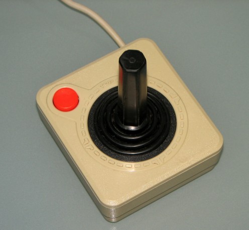 Similar to previous Atari controllers, but in matching cream.