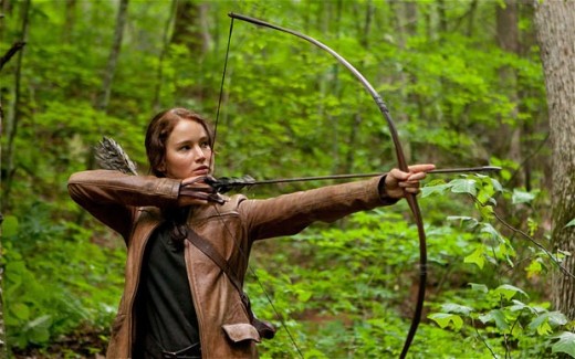 Jennifer Lawrence stars as Katniss Everdeen, a teen who must fight to survive in a brutal game show on a future Earth.