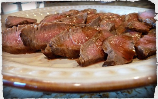 Thinly sliced flank steak is tender and inexpensive. I purchased this one for $6.00 and it, along with two side dishes, fed my family of four quite nicely.