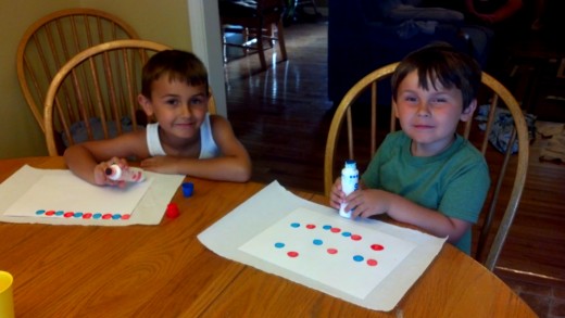 My little cupcake assistants working hard on the wrappers.