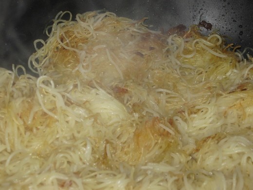 Turn noodles as they become a light golden brown.