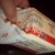 Store brand butter is lower priced, and works just as well as the fancy brands. Use a little on the bottom of the pot when you first cook the rice.