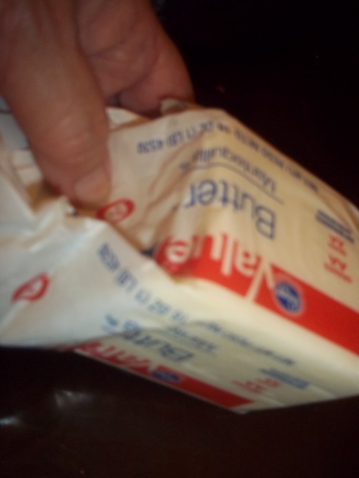 Store brand butter is lower priced, and works just as well as the fancy brands. Use a little on the bottom of the pot when you first cook the rice.