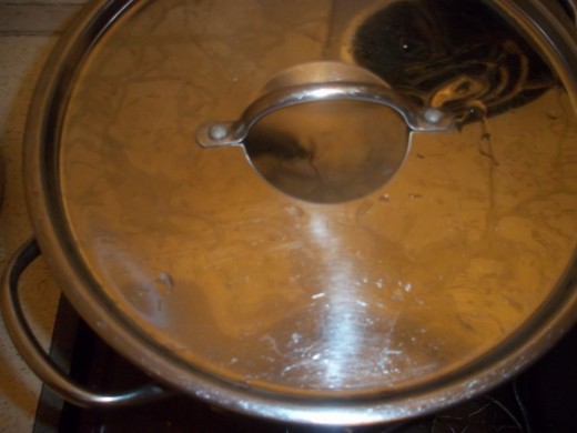 After turning down heat to simmering the rice, the lid needs to keep the steam in the pot.