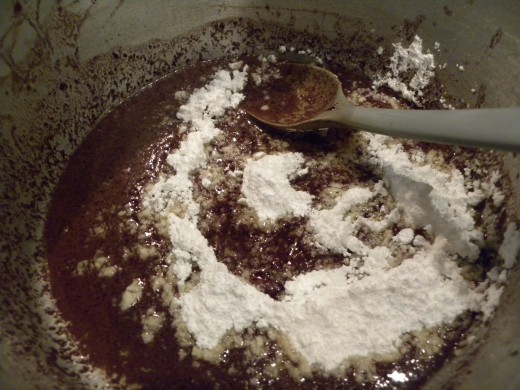Stirring in the powdered sugar.