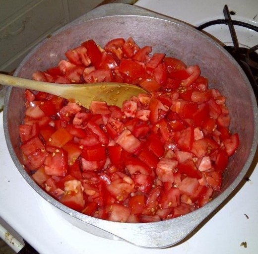 Roma tomatoes in stew pot