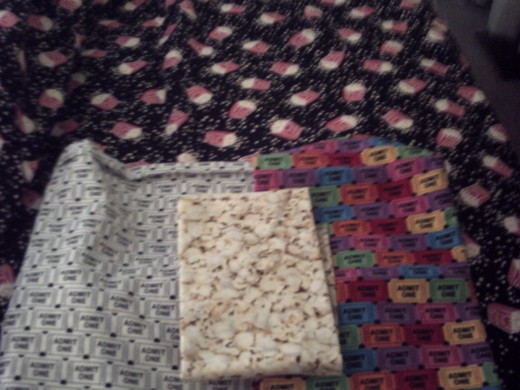 This is box of popcorn quillow pocket two and if I can find in my stash the special kitties eating popcorn and watching a movie that will fit on option pocket three as she has kitties