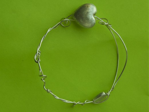 Simple bracelet which can be worn with other bracelets or alone.  This is what I consider doodling with wire.  This bracelet can be found on: https://www.etsy.com/listing/101094670/sterling-silver-spring-heart-bracelet