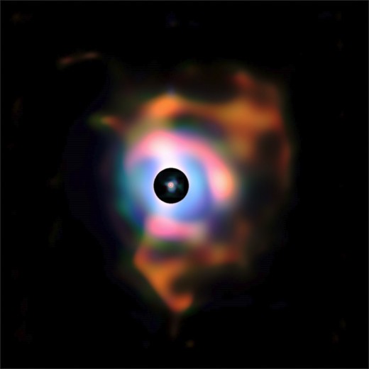 This photos shows at least two nebular shells thrown off by Betelgeuse, which lies at the center.and seen as a tiny red dot. These are the results of various fusion flashes in the past.