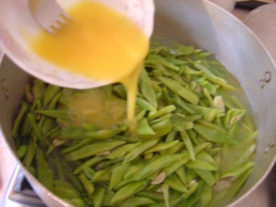 Add eggs to the beans