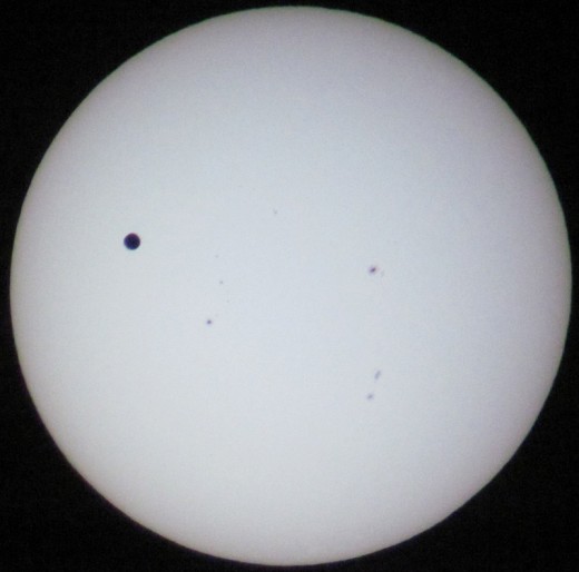 Transit of Venus 6:10 PM. It's moving! Also, the sunspots are changing slightly.