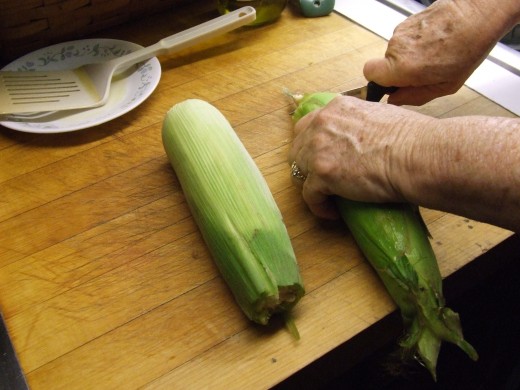 Cut the ends off your cobs of corn.