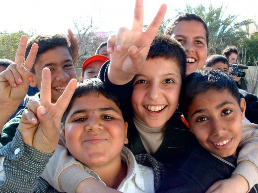 Boys from Iraq smiling and giving peace signs to the photographer. Makes me more optimistic for the future. 