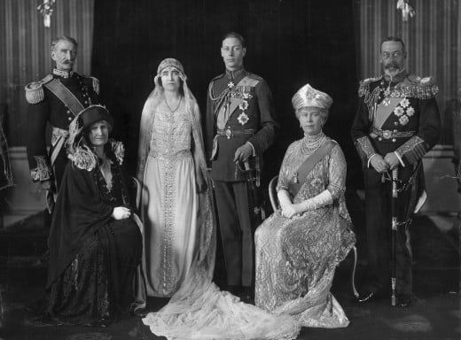 The wedding. On the left are Lady Elizabeth's parents, the Earl and Lady Strathmore. On the right are the Duke's parents, King George V and Queen Mary.