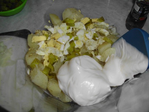Mixing 1/3 of all the ingredients and seasoning together and repeat till all incorporated.