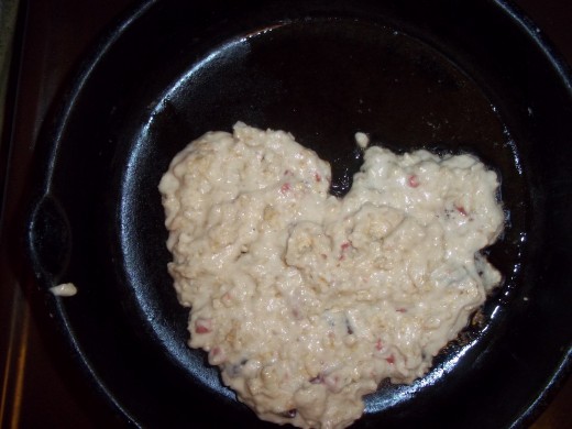 Heart shaped pan cookie in hot skillet