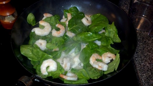 Add the shrimp and spinach to the pan.