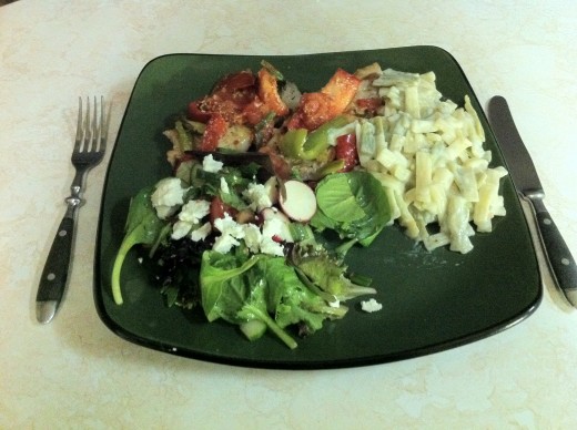 Pork loin chops with a vegetable topping,Spring salad, and fettuccine  pasta.