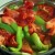 Green & red peppers with tomatoes and scallions, sautéing in extra virgin oil, and Greek seasoning. 