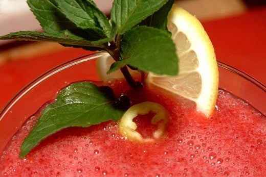 A fresh garnish makes any drink look more appealing, and can give a clue to the person drinking it as to what surprises may be lurking in a colorfully inviting red rum cocktail!