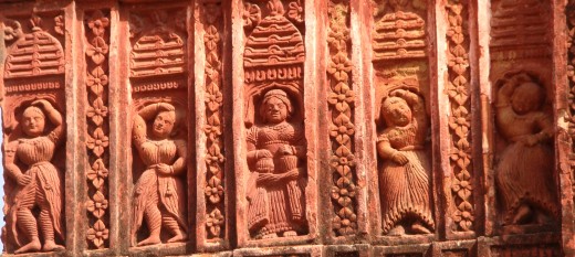 A group of dancers with a central figure with BAYAN & TABLA, traditional percussion instruments; the dresses indicate some form of Non-Gaudya dance form; debipur