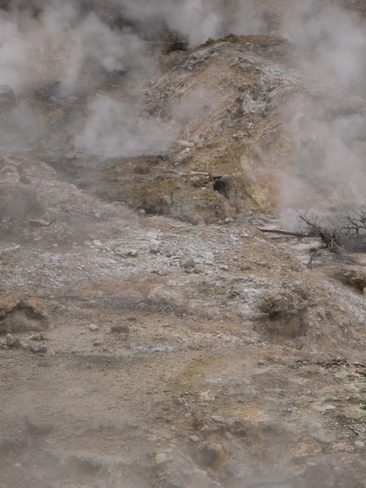 Steam and sulfur-blasted earth in the Qualibou caldera of the active Caribbean volcano near Soufriere, Saint Lucia.