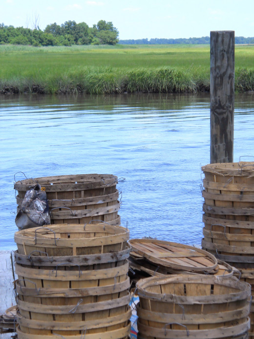 Empty wooden crab buckets on dock. 