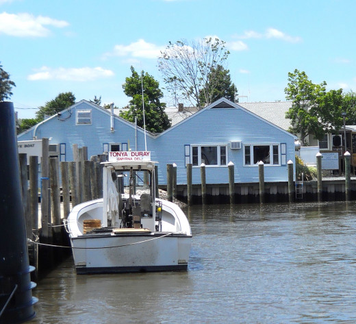 Back view of Tonya Duray crab boat. Sambo's Tavern is the blue building in front of the boat.