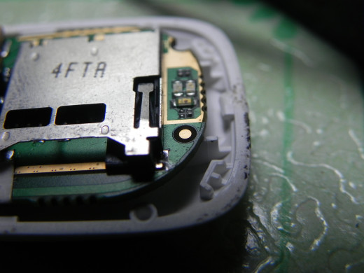 the unit's antenna is the copper dot. Solder your extension here.