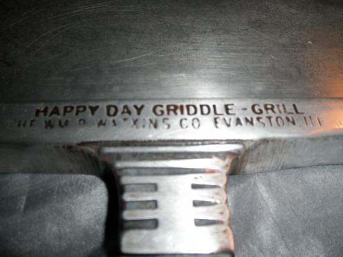 Happy day griddle grill front where the markings of where it was made are. 