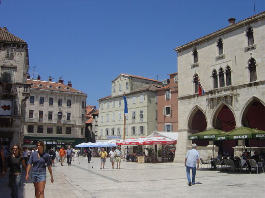 The view from the Western (or Iron) gate, facing the Square itself.  The Arched building to the right was the city hall in the middle ages.  There are many palaces here built by the citizens of Split, many are now museums.