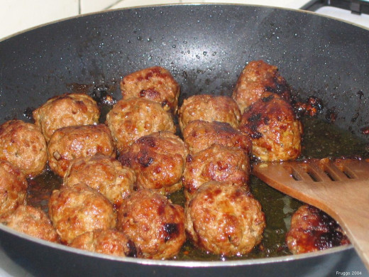 The meatballs must get a little color in the pan, but not burn.  A wooden spoon may be used after about five minutes of cooking.  If they are moved too soon, they will crumble and lose shape.  Almost time to add the beer sauce!