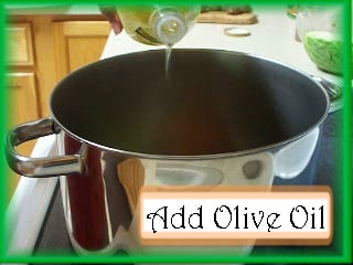 Adding Olive Oil to the Albondigas Pot: Cover the bottom of the pot with olive oil.