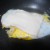 Add cheese to egg in pan to melt slightly.