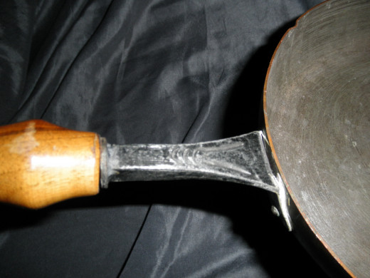 The handle of a Stockli Netstal copper pan