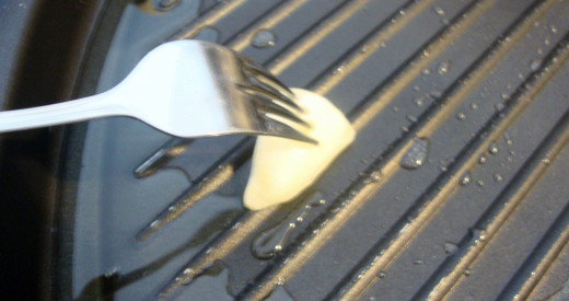 Rubbing garlic on a hot-oiled pan is a great way to infuse flavor into your cooking.
