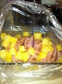 Top the ham with pineapple chunks or rings. Pour in the drained cherries if you add them. (This time I did not.)