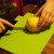 Carefully cut the lemon in half. Carefully cut the lemon in half.