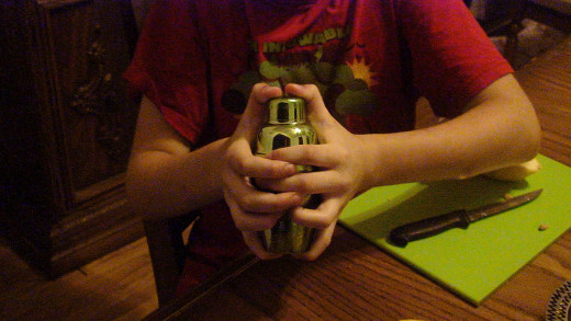 Shake the mixture firmly until the cocktail shaker feels cool or cold.