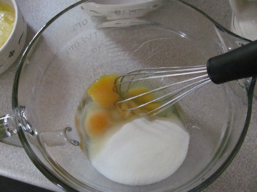 Whisk the eggs and the sugar together