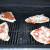 Grilled pizzas ready to finish cooking 