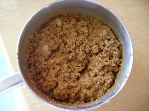 Ground beef, onion, and refried bean mixture--it doesn't look too appetizing like this, but just wait! :)