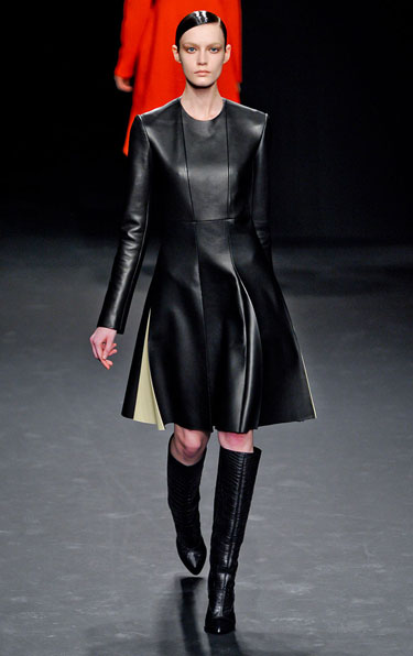 This black leather dress is edgy and girly.