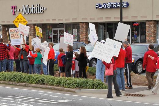 Parents in DeKalb County, GA, a suburb of Atlanta, protest one of many bad decisions made by its local school board - placing cell towers on school grounds to create a 30-year eyesore in neighborhoods with a nice slush fund for those at the top.
