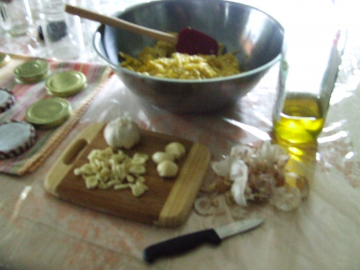 Put the Squeezed Squash in a large bowl, add Garlic and Olive or Vegetable oil.