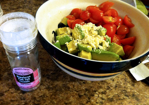 Put the sturdy ingredients on the bottom, cucumber and olive first, then avocado, tomato, feta. 