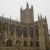 Bath Abbey towers over the Roman Bath museum. Bath Abbey towers over the Roman Bath museum.