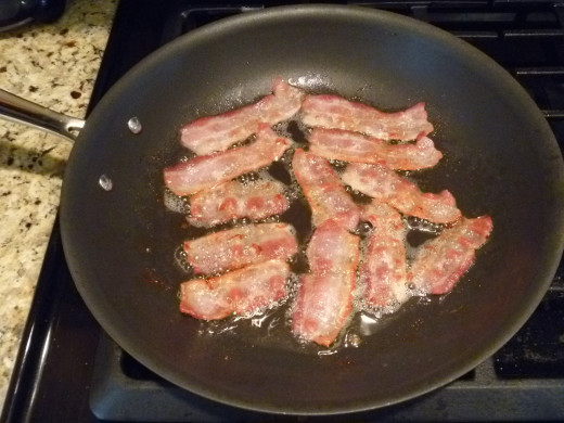 Because they are going to get chopped up anyway, I like to cut the strips of bacon in half before cooking. It makes them fit in the pan better and they are easier to flip.