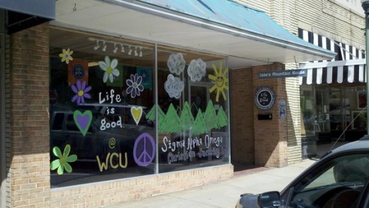 The store window for Jake's Mountain House a local clothing store in Sylva, NC during WCU's Paint the Town Purple.